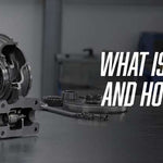 Turbocharger exploded view showing compressor wheel, turbine shaft, and housings disassembled on a workbench with text reading "WHAT IS A TURBOCHARGER AND HOW DOES IT WORK?"