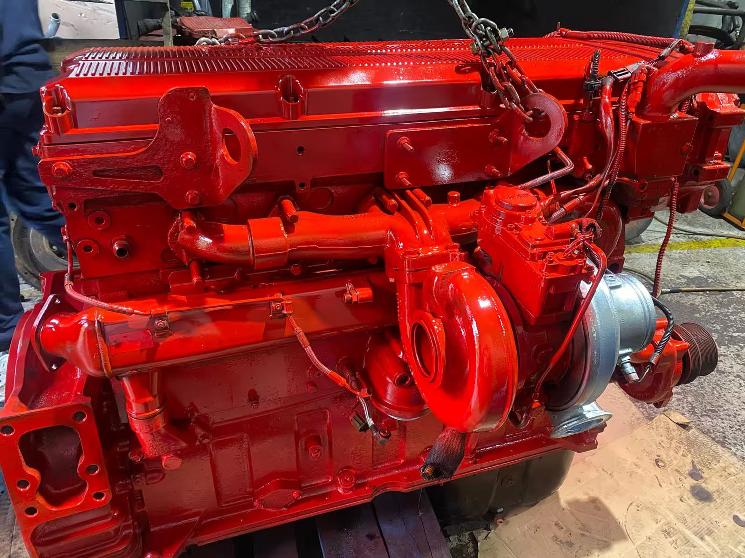 Red engine block on a mechanical workbench