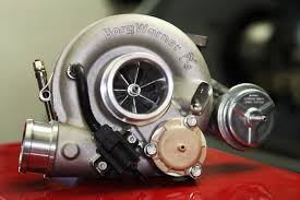 Turbocharger on a red surface with 'Garrett' branding