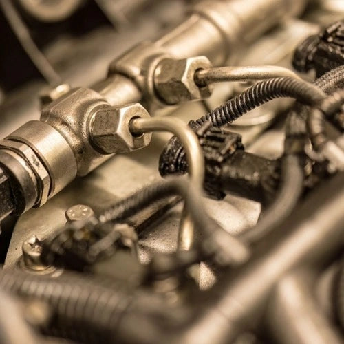 Close-up of mechanical components with visible bolts and wires in a sepia tone.