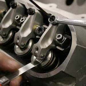 Close-up of a mechanical component with gears and a screwdriver