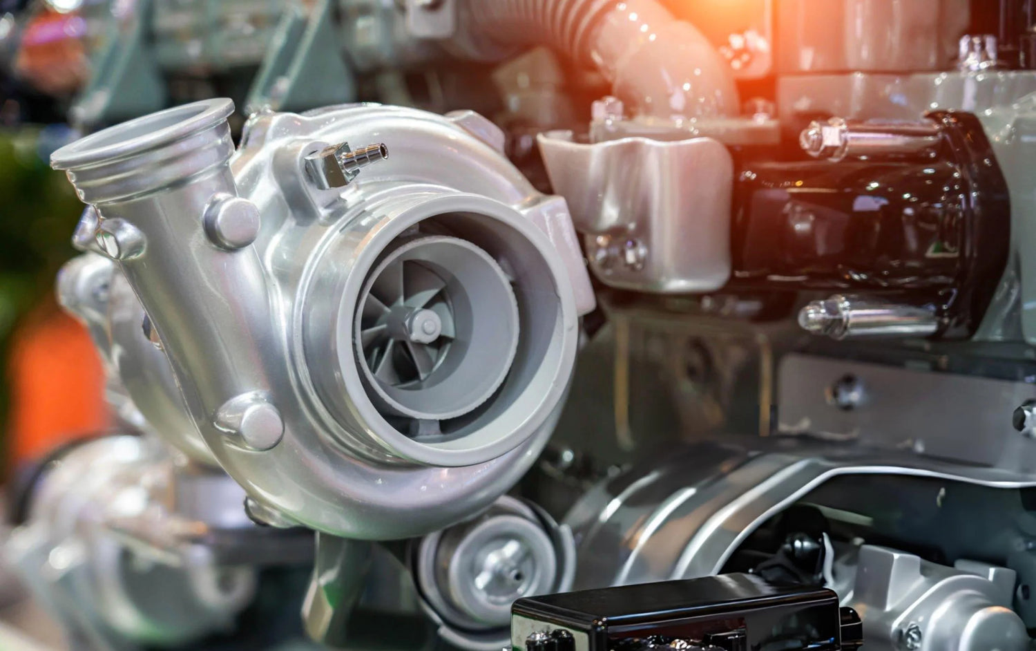Turbocharger on a car engine with blurred background
